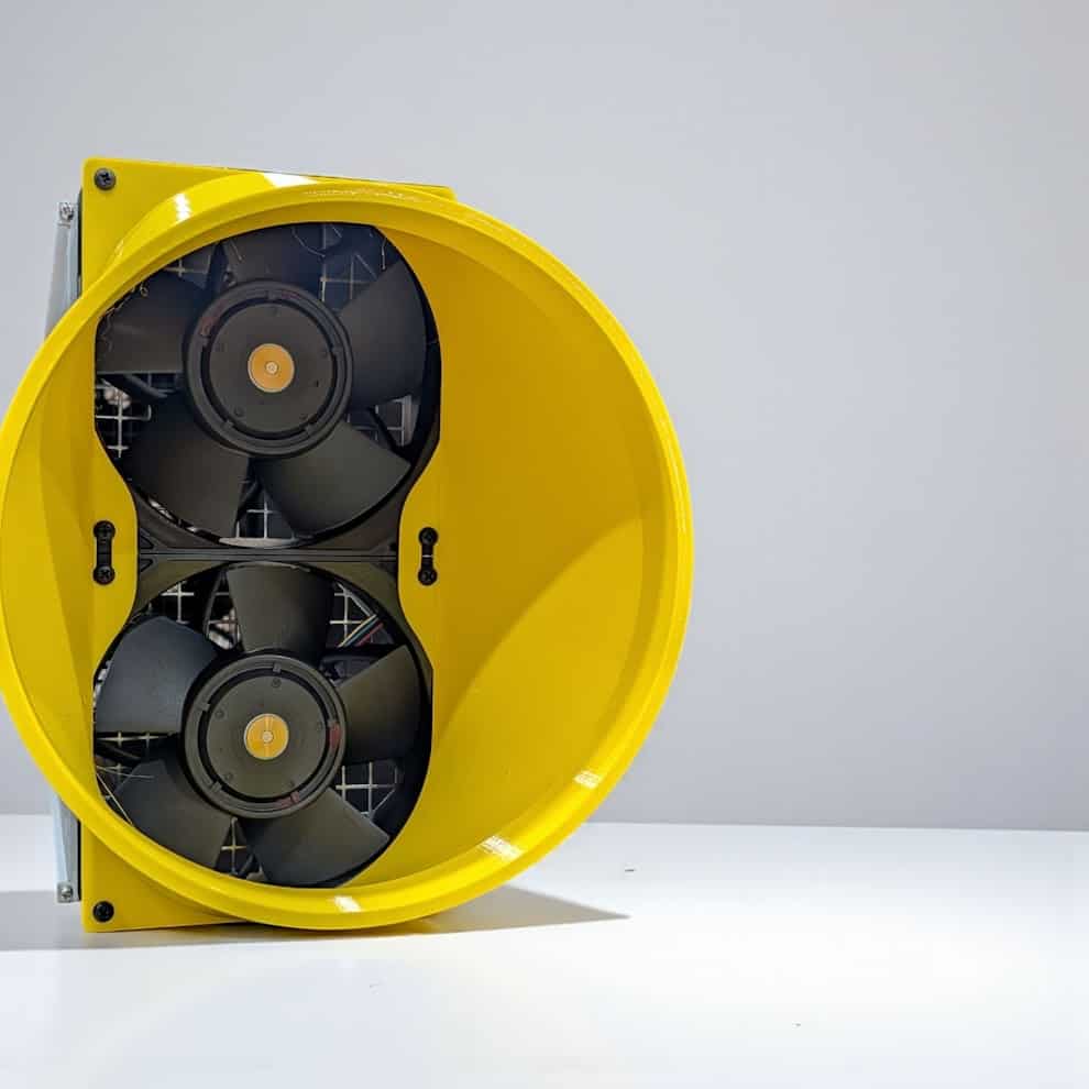 Yellow CryptoCloaks Antminer dual-fan exhaust shroud, front view showing the two 140 mm fans