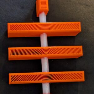 3D-printed three-bar sats symbol in Bitcoin orange